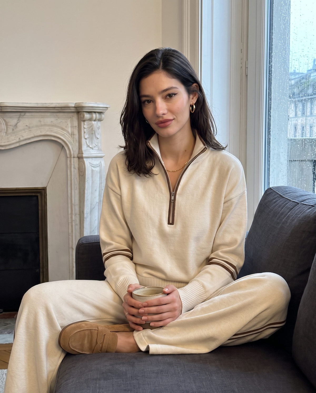 Half-zip knit lounge set in ivory in a Milan apartment