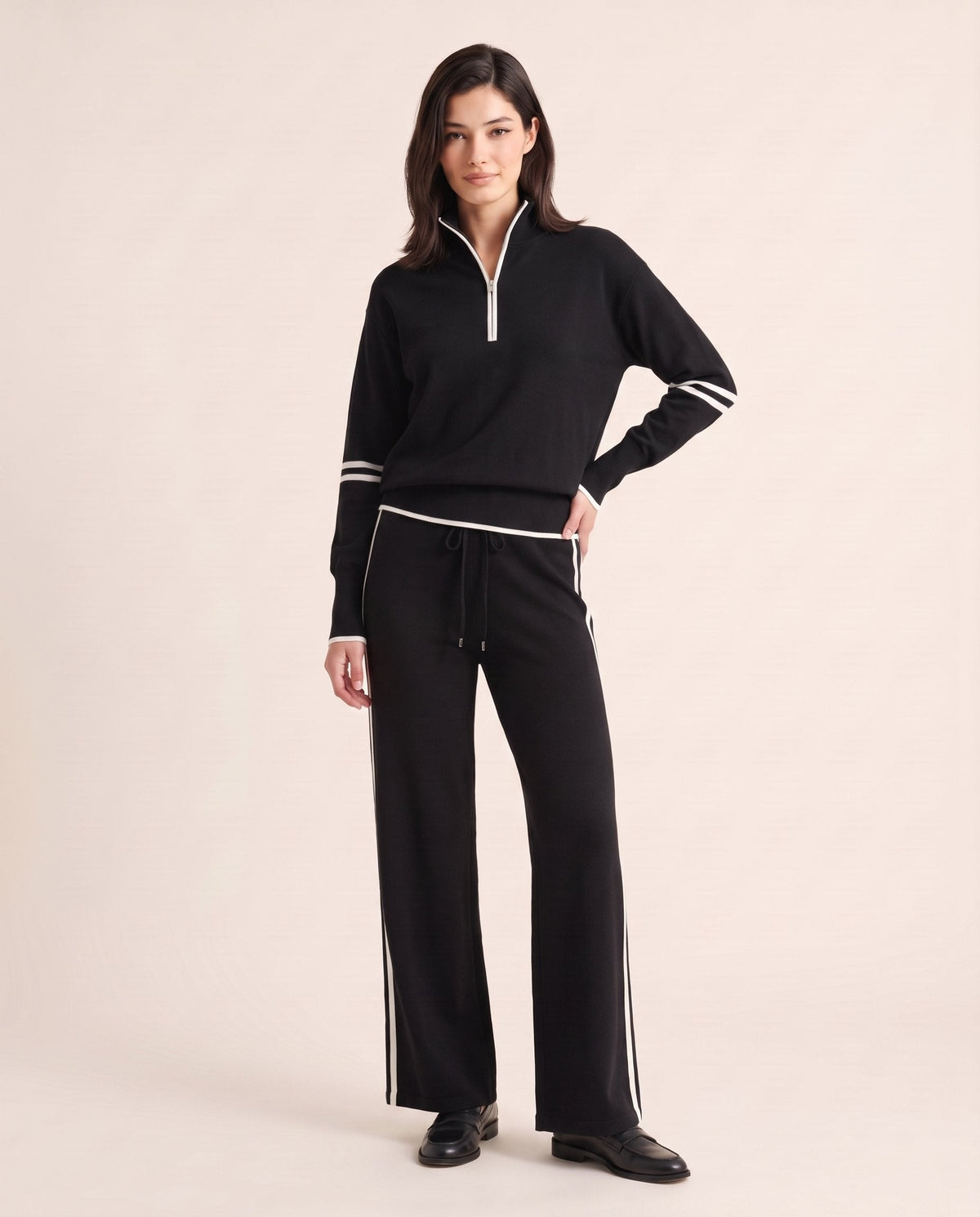 Half-zip knit lounge set in black with white stripes, front view