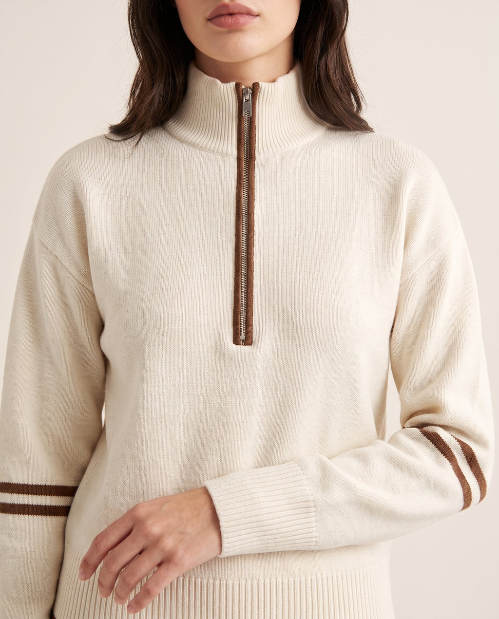 Half-zip knit lounge set in ivory, detail of the zip collar and contrast stripes